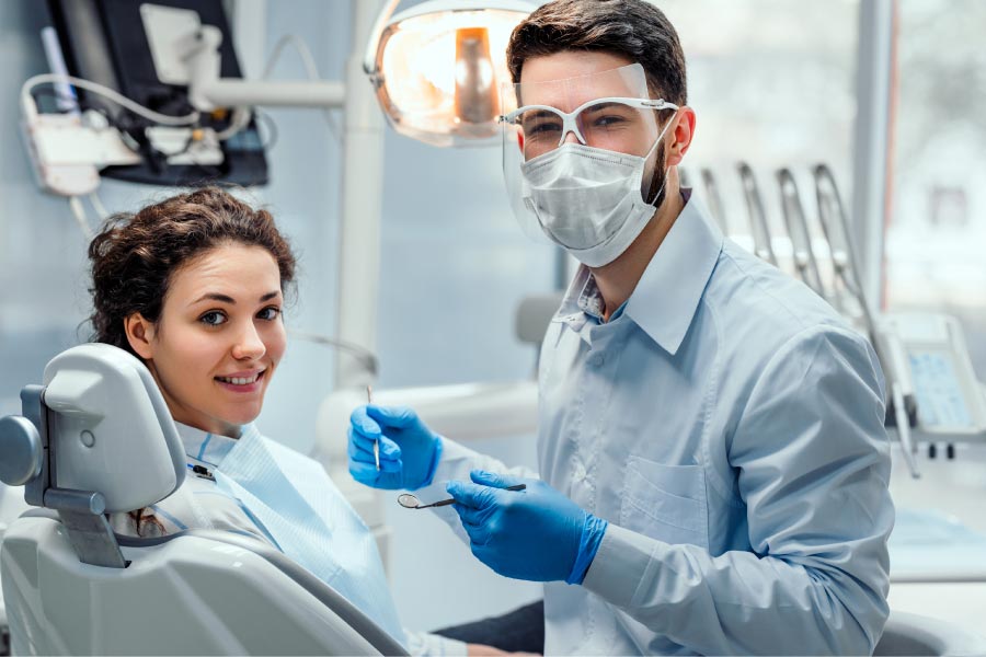 young girl getting a fluoride treatment ant the dentist